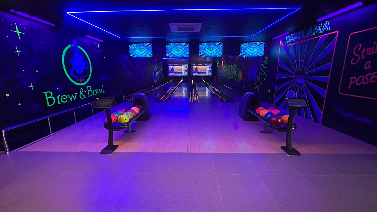 Brew & Bowl neon bowling lanes in Kelambakkam