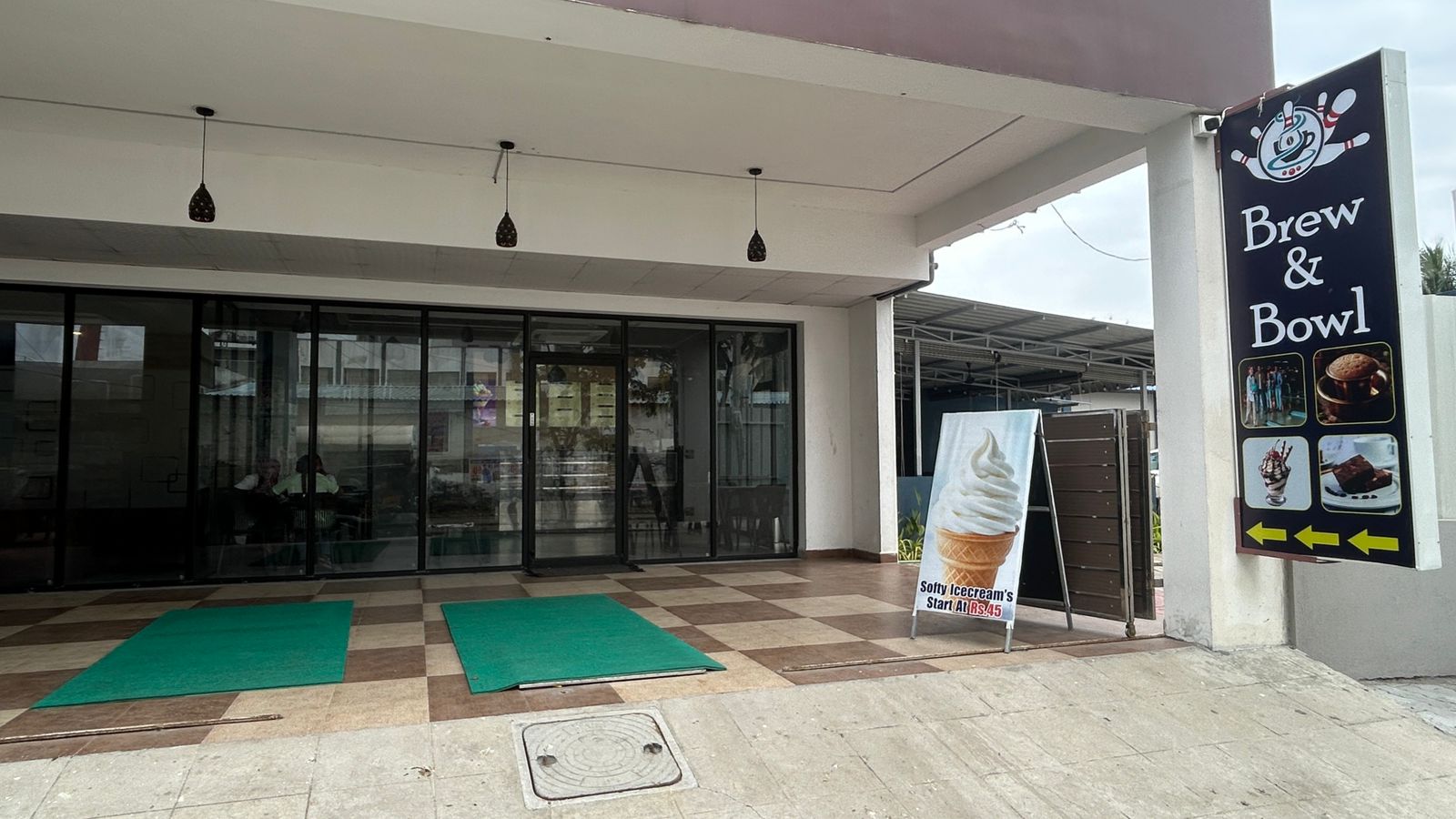 Brew & Bowl storefront signboard at Kelambakkam OMR