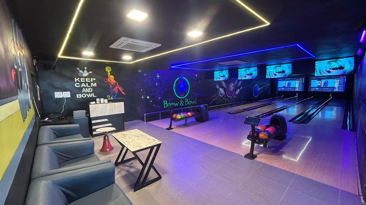 Lounge seating and bowling area at Brew & Bowl