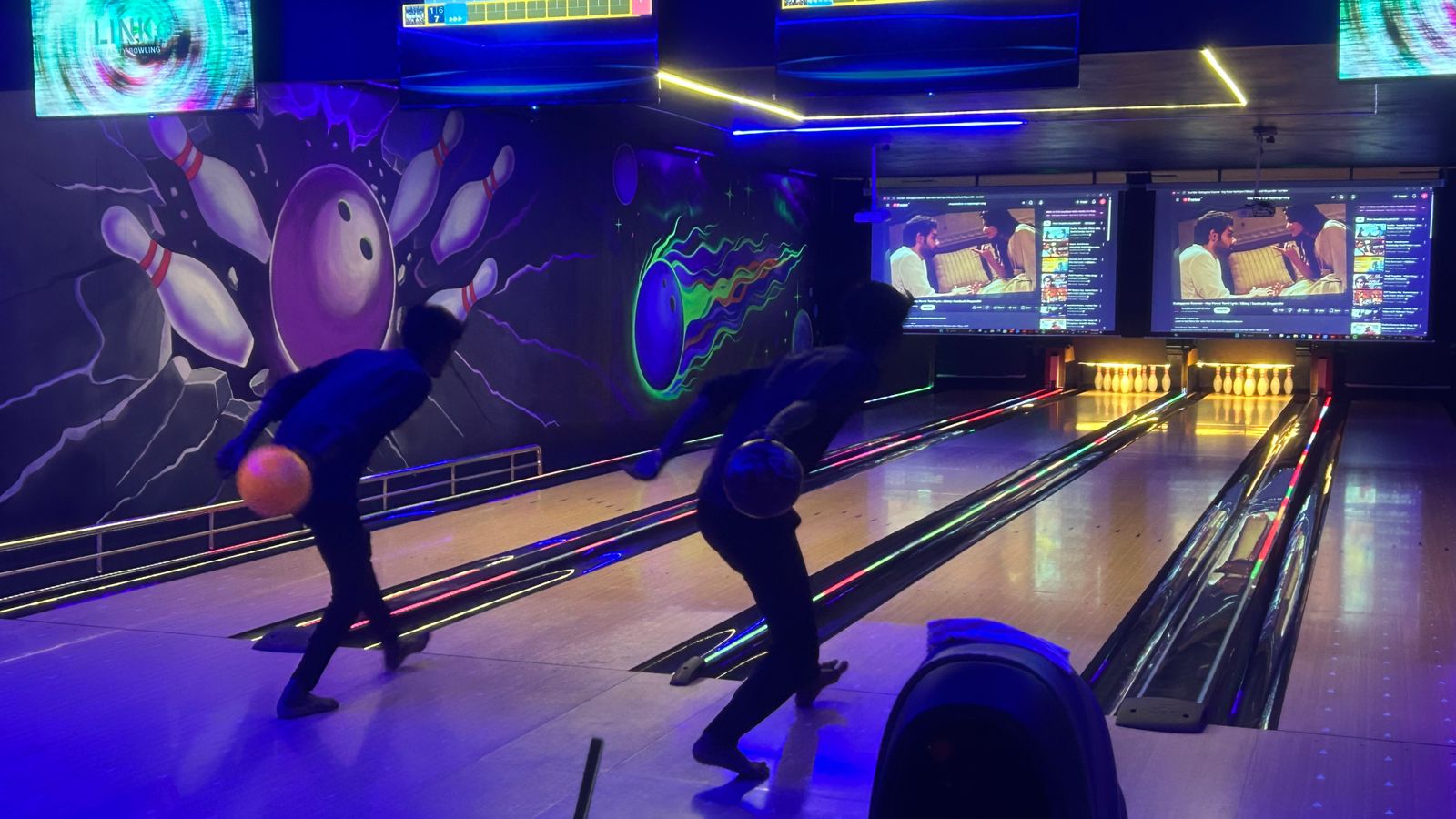 Friends bowling together at Brew & Bowl